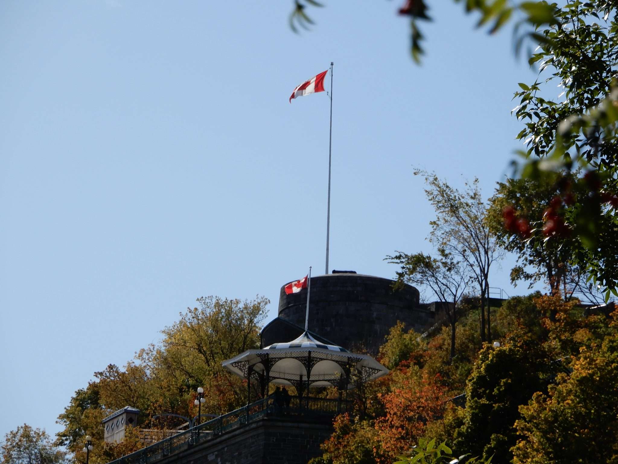 A vibrant image of Canadian flags flying in Quebec City, showcasing the nation's cultural pride.