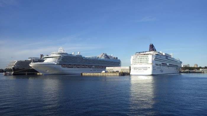 A beautiful view of cruise ships docked in Victoria, British Columbia, offering scenic tours of the coast.