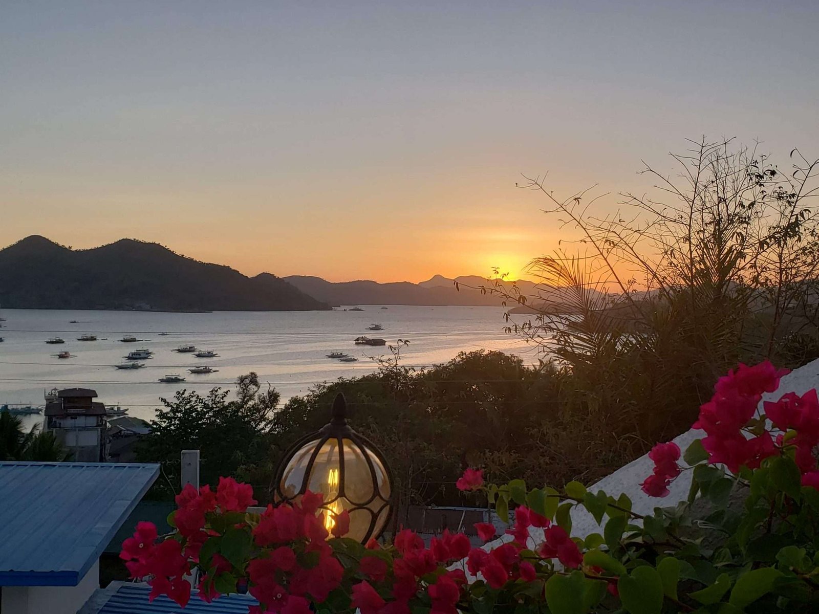 A serene sunset over Palawan, Philippines, known for its clear waters and pristine beaches.